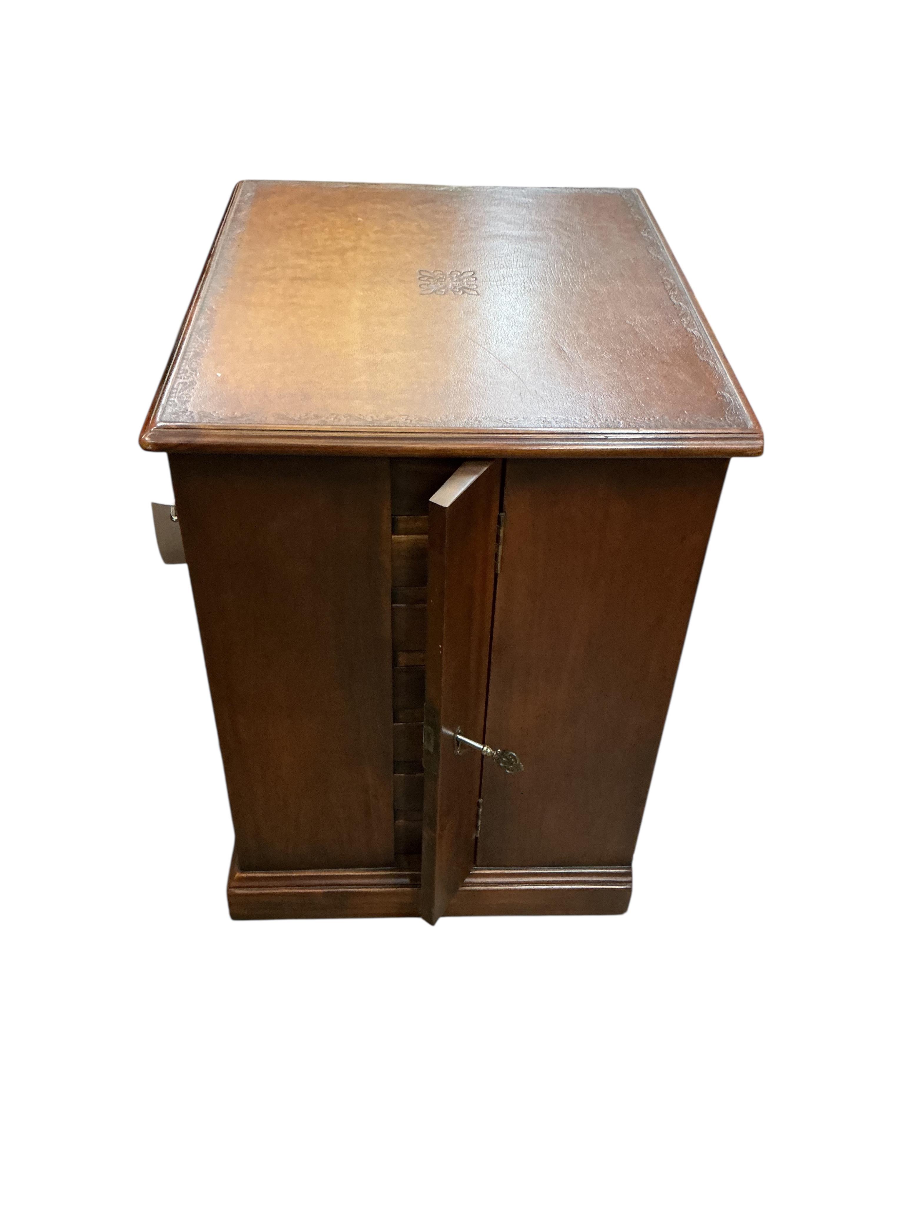 A reproduction mahogany seven drawer collector's chest with leather inset top, width 48cm, depth 40cm, height 56cm